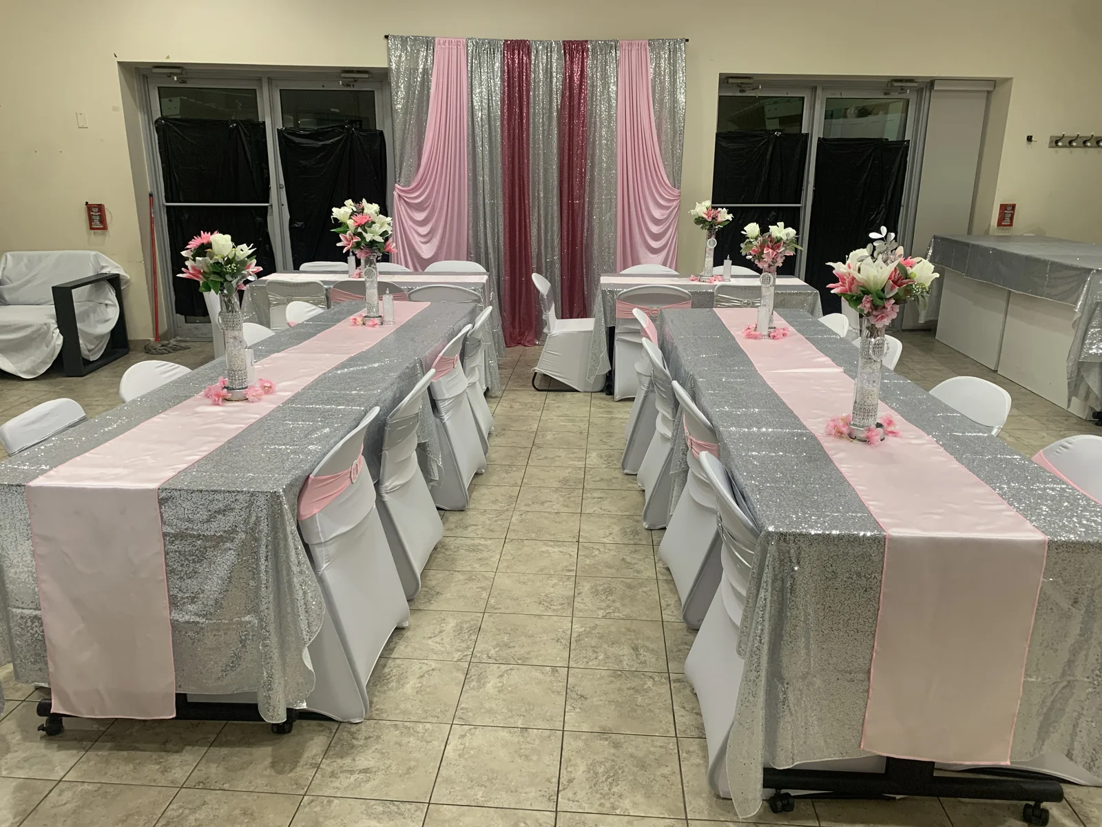 Room view showing the tablescapes and draped focal point